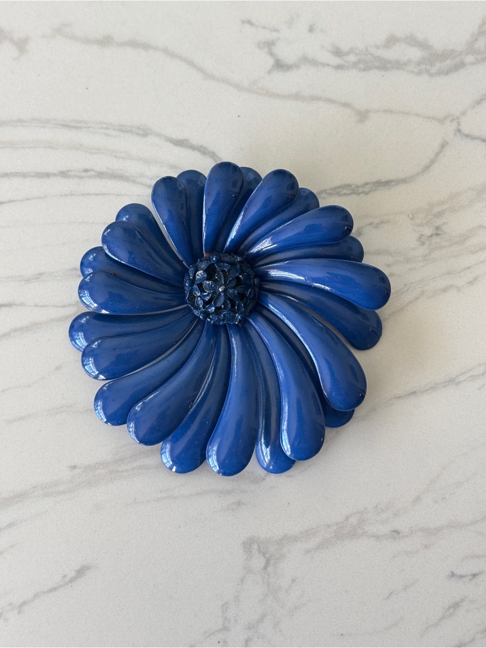 Vintage enamel and metal pin, blue swirl daisy